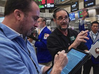 Asian shares, US futures gain as Japan keeps its key interest rate unchanged