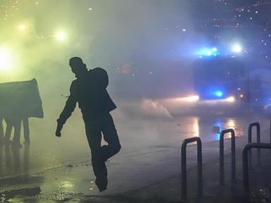 Italian police fire tear gas as protesters clash near Olympics hockey venue