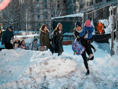 Northeast US digs out from brutal snowstorm that disrupted flights and canceled school